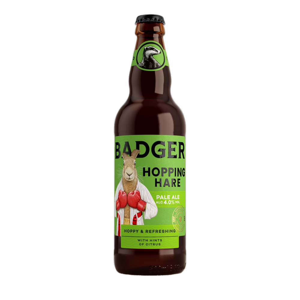 Bottle of Badger Hopping Hare ale, 500ml, with a green label featuring a hare illustration and the Badger logo at the top.