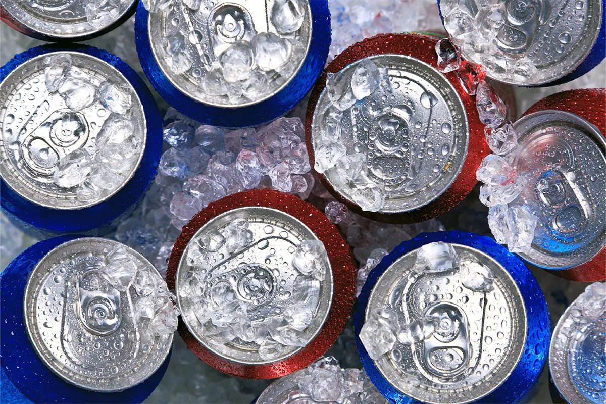 Chilled cans packed in ice, showcasing Bargain Booze’s sold cold range as part of Oktoberfest and Freshers Week drinks deals.