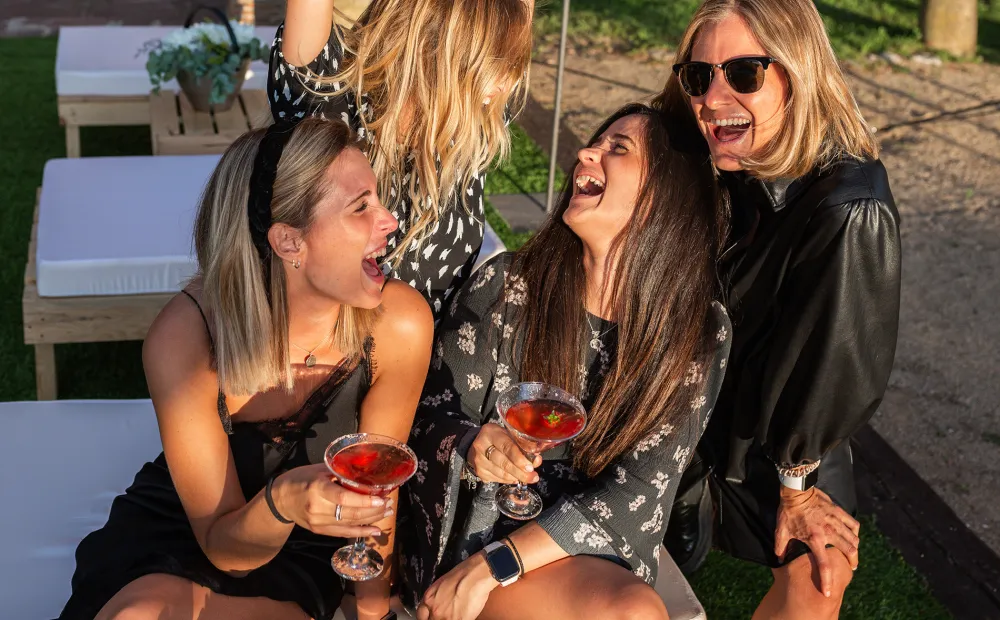 Friends enjoying cocktails together outdoors